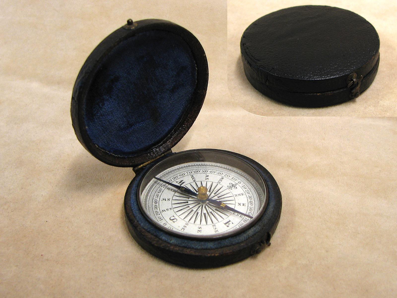 Early Victorian pocket compass in leather covered outer case circa 1860
